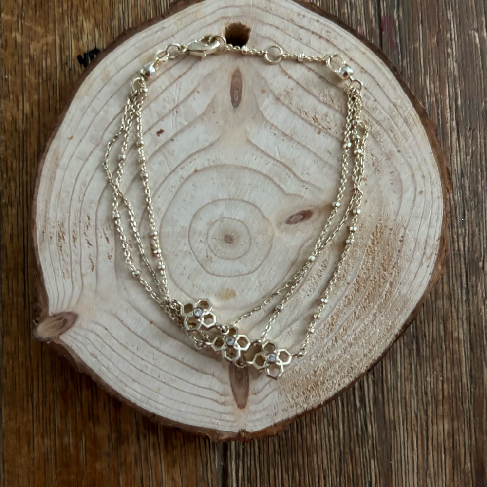 Kendra Scott Rue Bracelets. 3 Tiered dainty chain bracelet with flower accent.